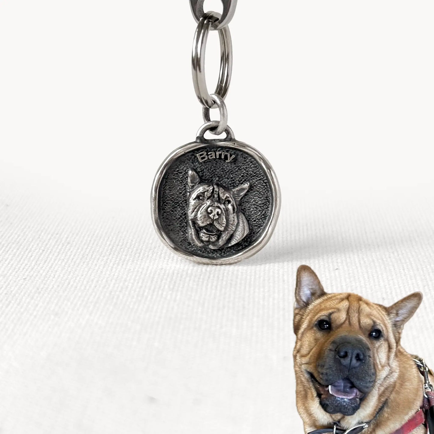 Custom silver pendant with an engraved portrait of Barry the Sharpei, made as a unique pet keepsake with personalized name.