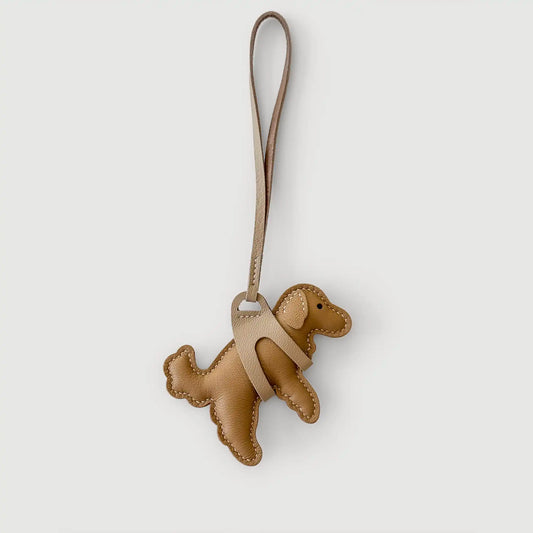 Brown dog-shaped keychain on a white background