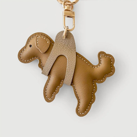 Brown dog-shaped keychain on a light gray background
