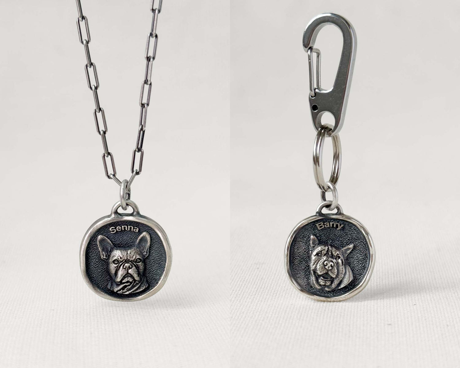 A silver pet pendant with a silver chain, and another with a stainless steel quick clip.