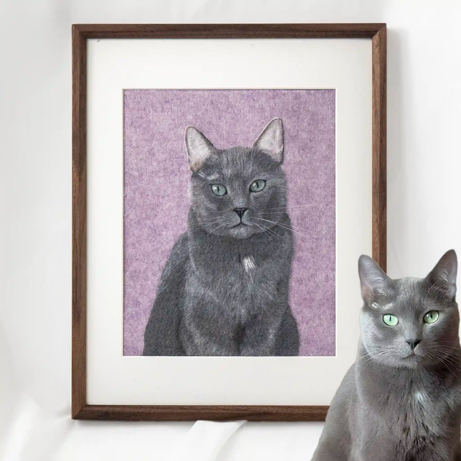 Framed wool felt portrait of Theo the Blue cat, custom-made with realistic grey tones and striking green eyes.