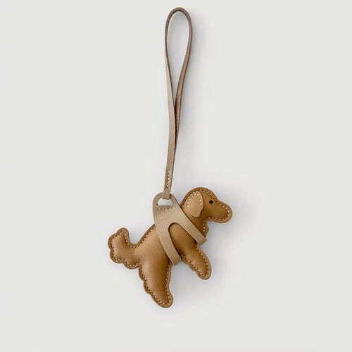 Brown dog-shaped keychain on a white background