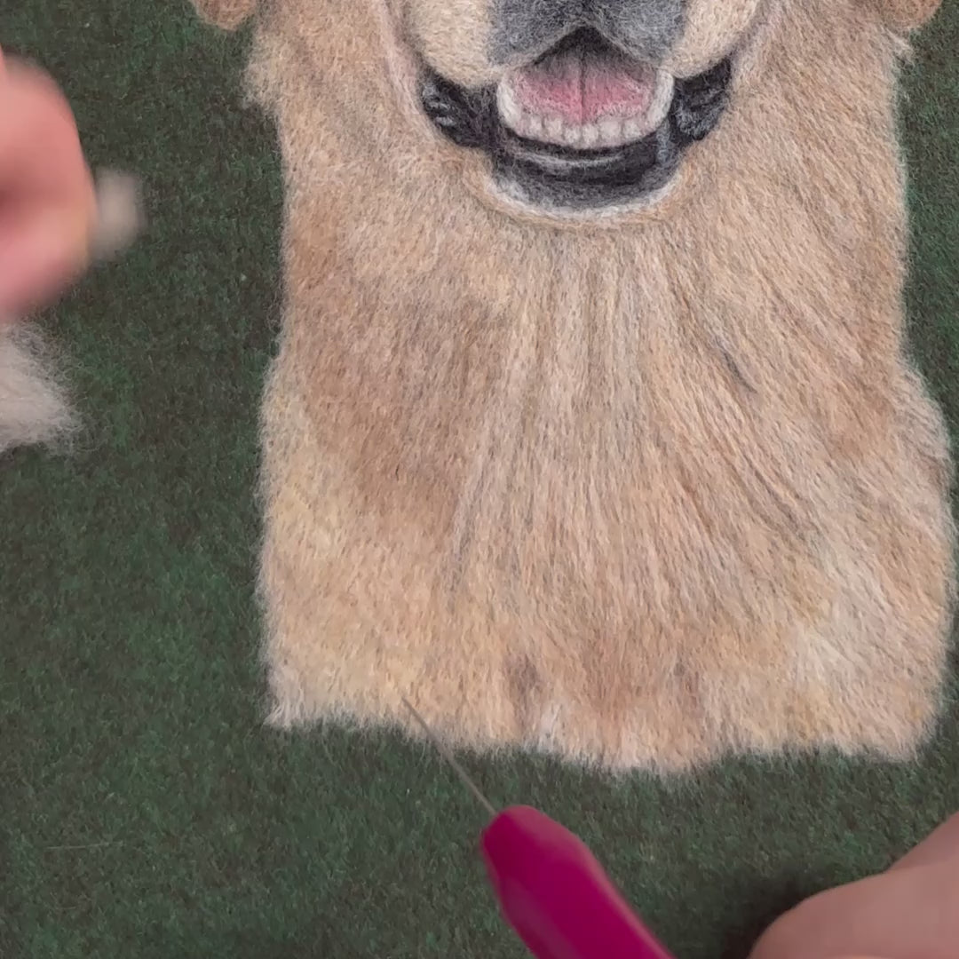 Video of creating a custom wool felt portrait of a golden retriever, handmade pet memorial artwork.